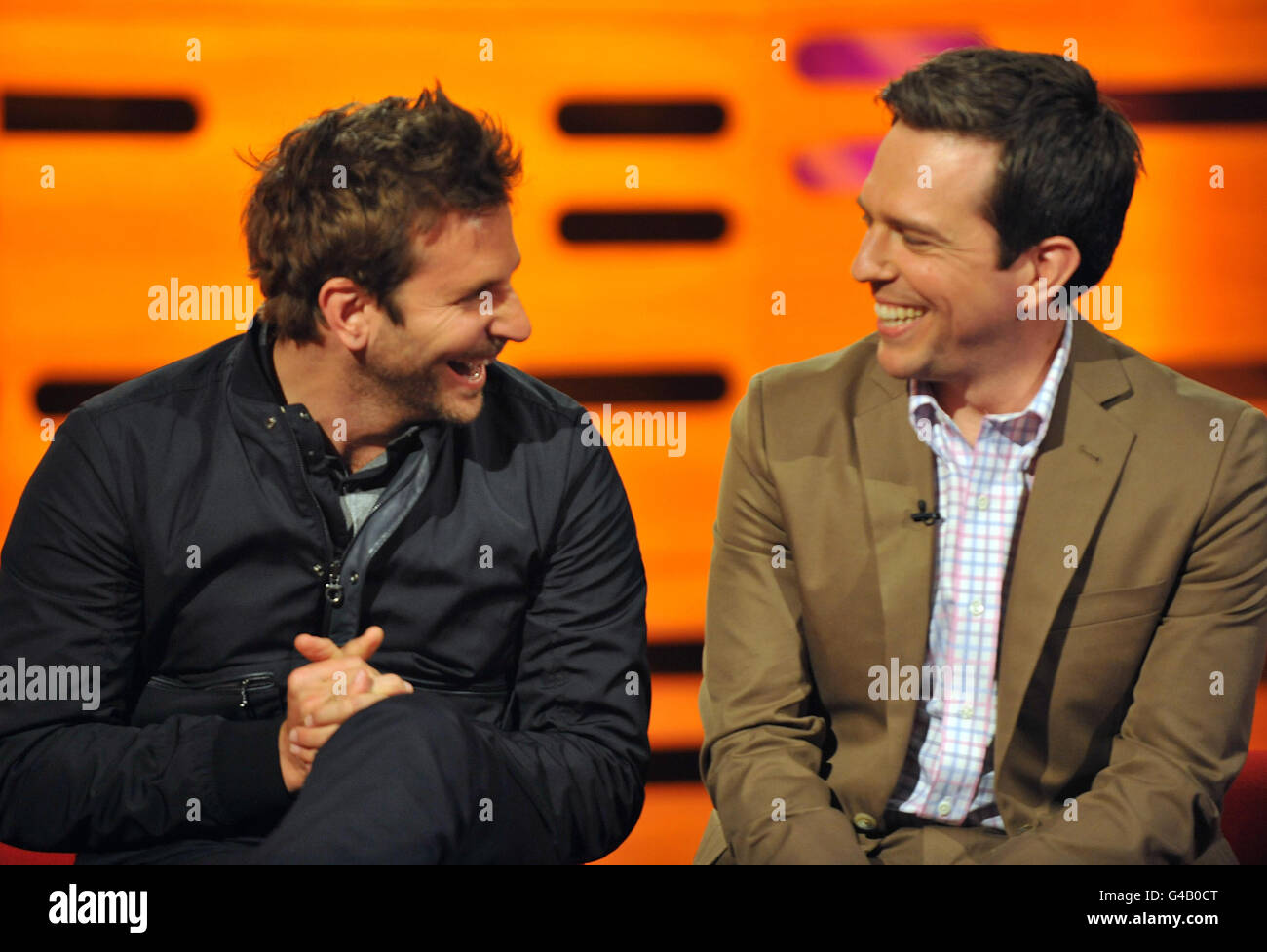 Left to right) Bradley Cooper and Ed Helms, during filming for the Graham  Norton Show at The London Studios, south London, to be broadcast on BBC One  Friday evening Stock Photo -