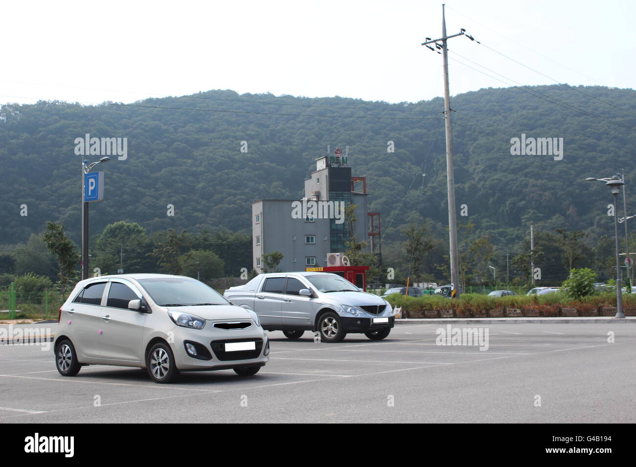 Cars at the foot of a mountain in Korea Stock Photo