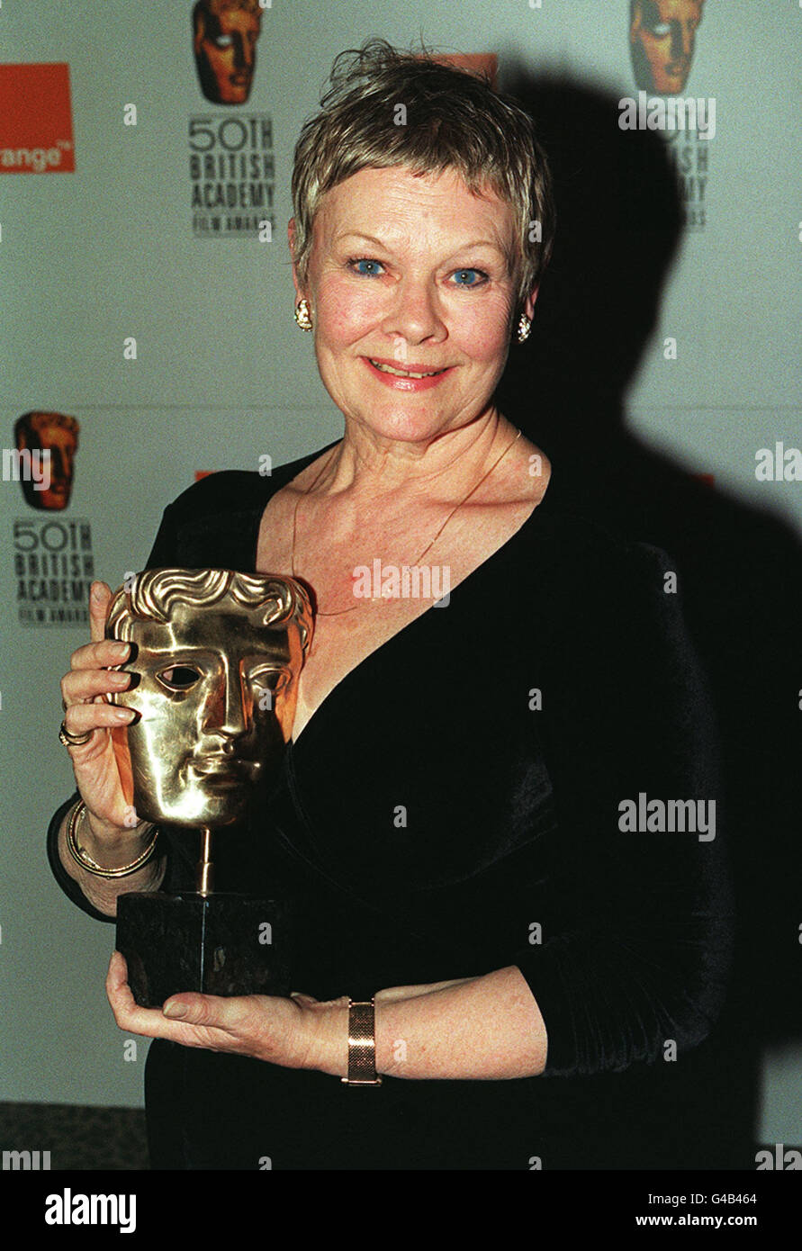 ACTRESS DAME JUDI DENCH WITH HER AWARD FOR BEST ACTRESS, WHICH SHE WON FOR HER ROLE IN THE FILM MRS BROWN, AT THE 50TH BAFTA AWARDS IN LONDON Stock Photo