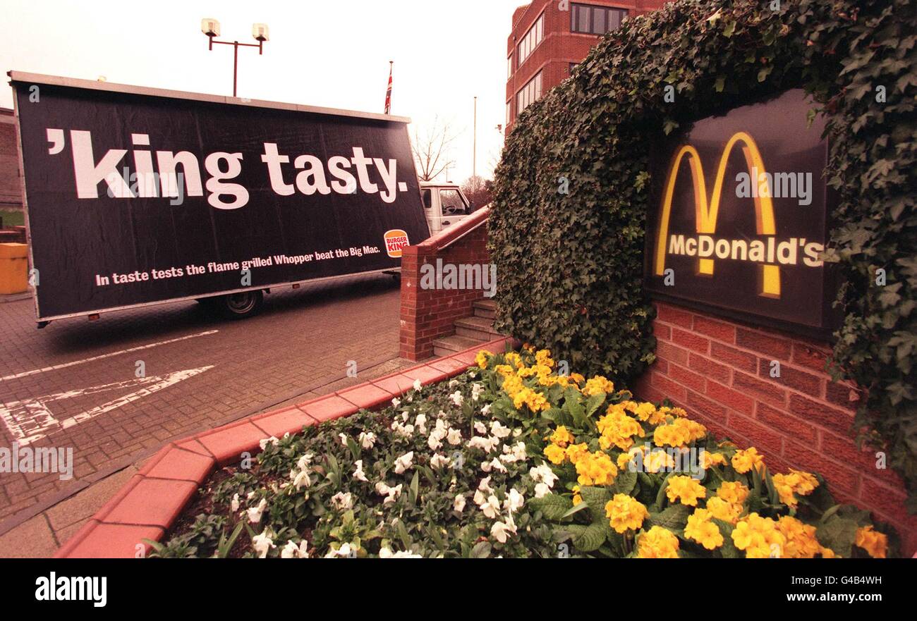 Fast food giant Burger King unveils a controversial new series of adverts, outside the headquarters of arch rivals McDonald's, today (Monday). The advertising watchdog was braced for complaints against the posters which carry slogans including 'The Not So Big Mac, Clever Burgers and 'king tasty.' See PA story CONSUMER Burgers. Photo by Peter Jordan/PA Stock Photo