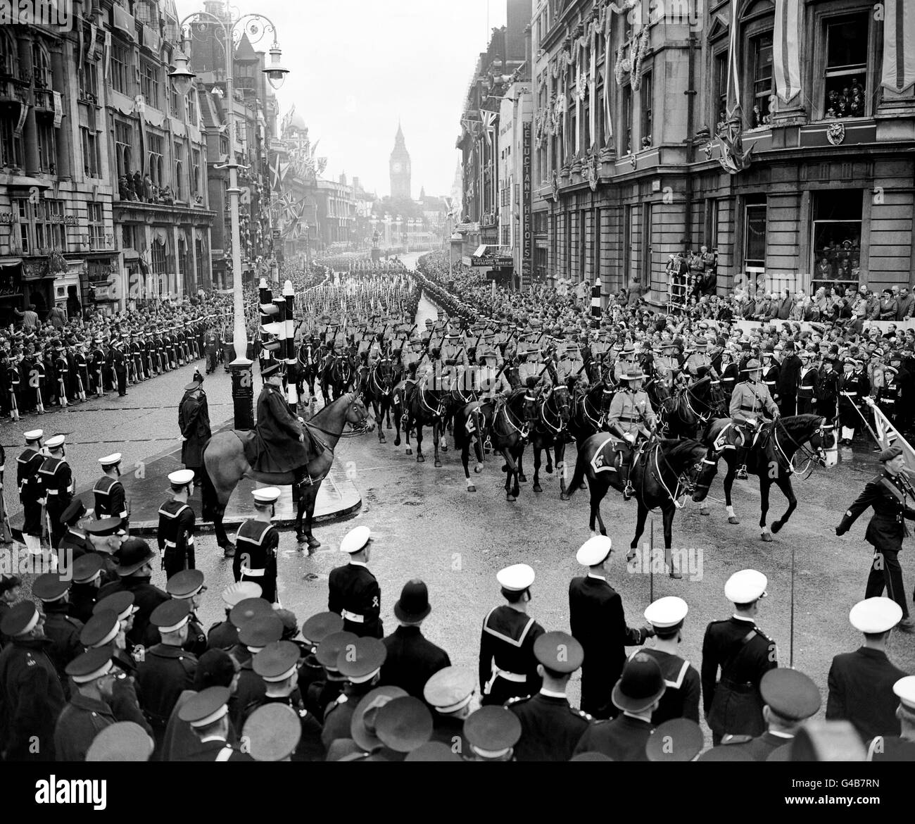 The contingent of the Royal Canadian Mounted Police at Charing Cross in the procession from Westminster Abbey to Buckingham Palace after the Coronation Stock Photo