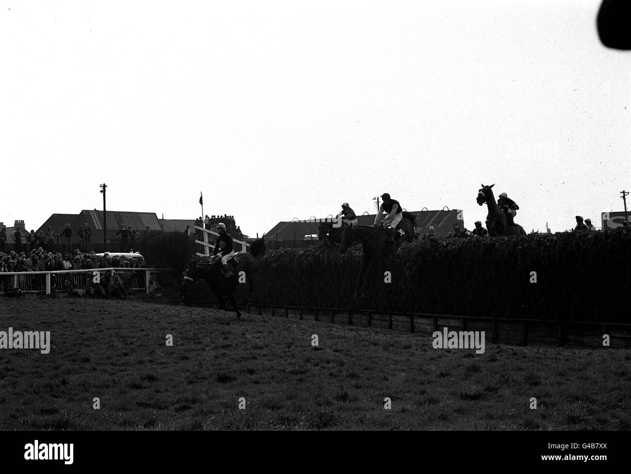PA NEWS PHOTO 31/3/74 'RED RUM' CLEARS BECHER'S BROOK (LEFT) IN THE GRAND NATIONAL RIDEEN BY BRIAN FLETCHER TO WIN THE FAMOUS YEARLY RACE AT LIVERPOOL Stock Photo