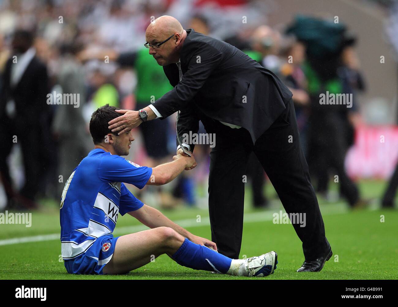 Reading Manager Reading manager brian mcdermott consoles shane long after the game hi ...