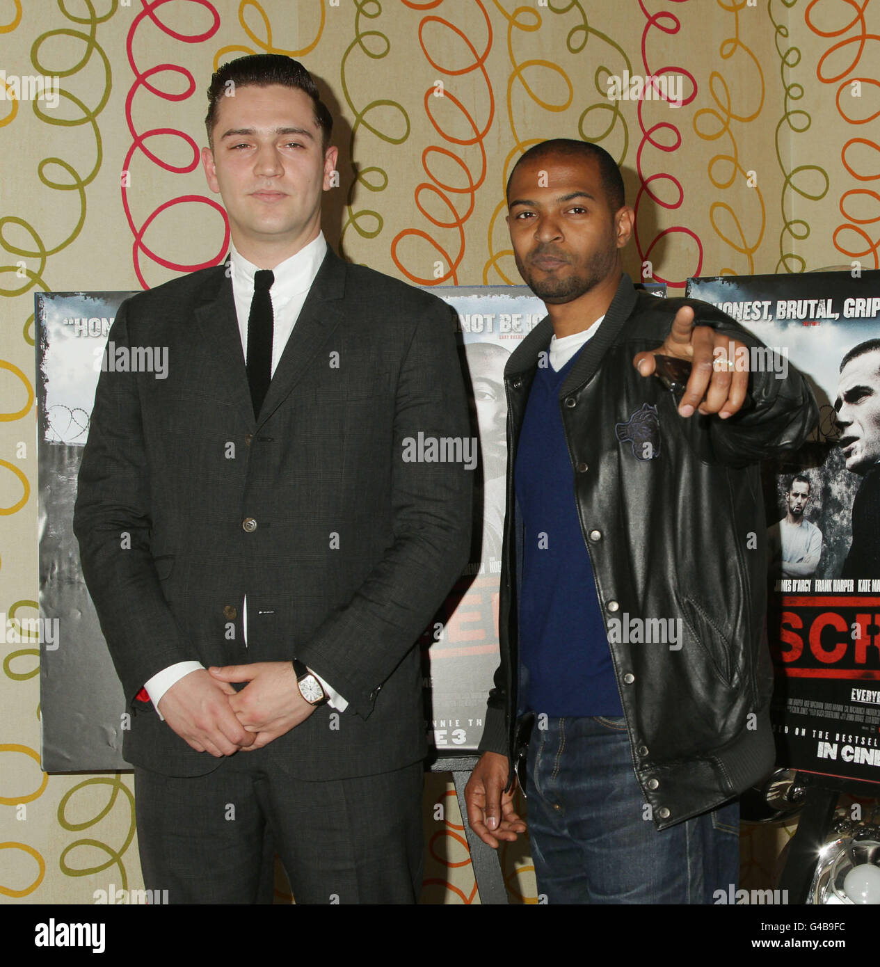 Director of the film Reg Traviss (left) and Noel Clarke arriving for the premiere of Screwed, at The Soho Hotel in central London. Stock Photo
