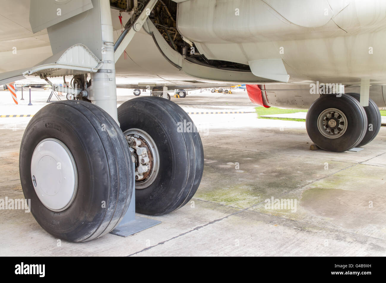 rear landing gear and engine passenger plane on the ground Stock Photo