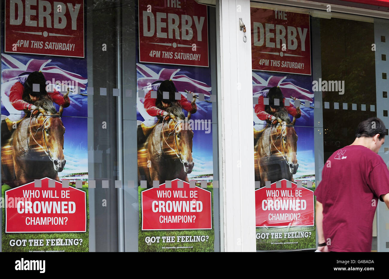 Carlton House owned by Her Majesty The Queen with jockey Ryan Moore in the Royal colours fills the windows of bookmakers shops across the UK. Stock Photo