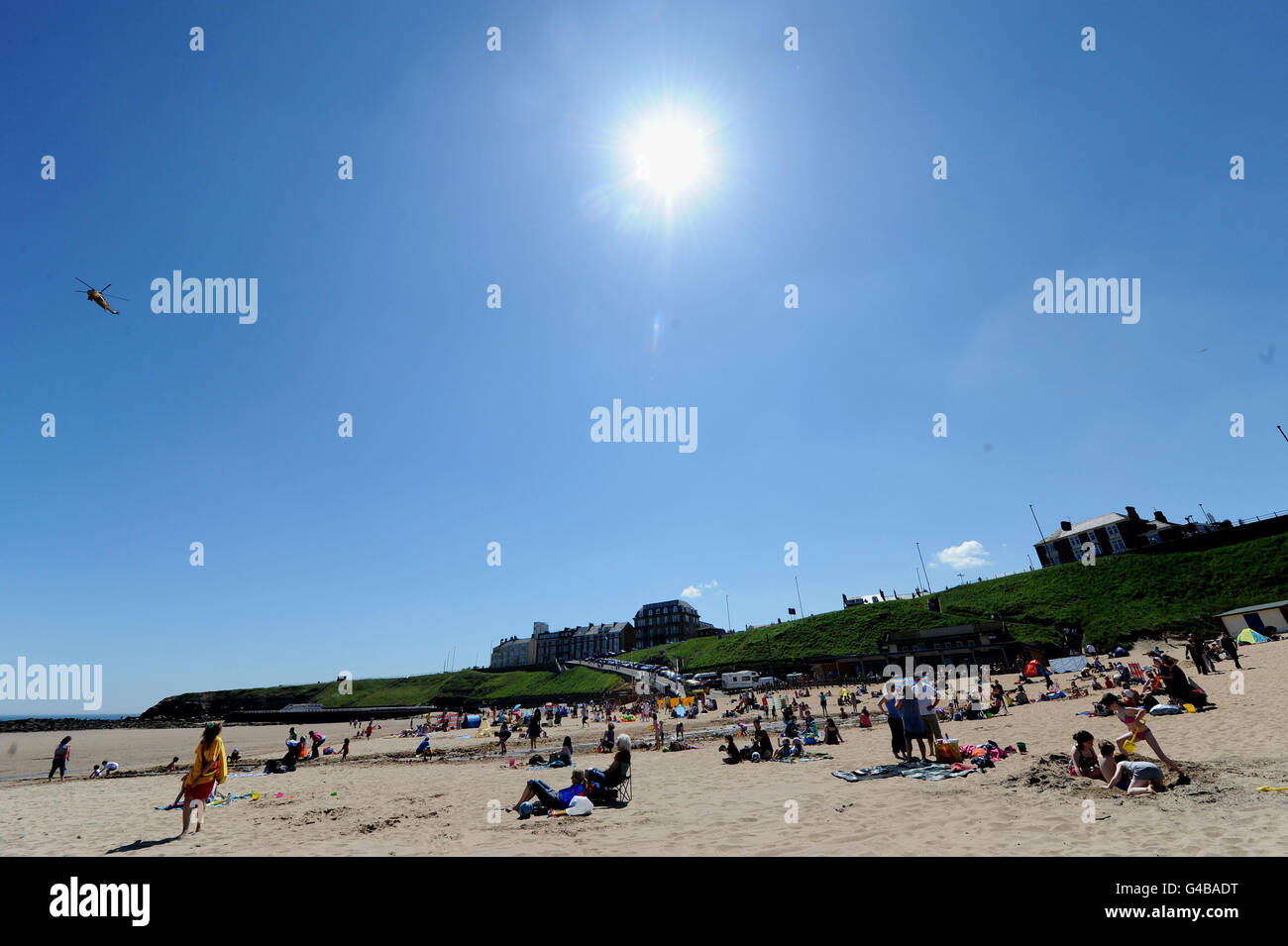 Members of the public enjoy the warm weather at Tynemouth beach, Tyne
