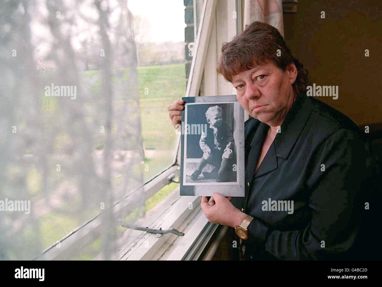 28th APRIL: On this day in 1968 11 year old Mary Bell murdered 4 year old Martin Brown in Newcastle. June Richardson at home in Newcastle with a photo of her son Martin Brown who was murdered by Mary Bell, the childhood killer 30 years ago has called on the Home Secretary Jack Straw to stop Mary Bell making money from her crimes today (Wednesday). Mary Bell is alleged to have been paid 50,000 to collaborate on Gitta Sereny's book, entitled Cries Unheard. See PA Story POLITICS Bell. Photo Owen Humphreys/PA Stock Photo