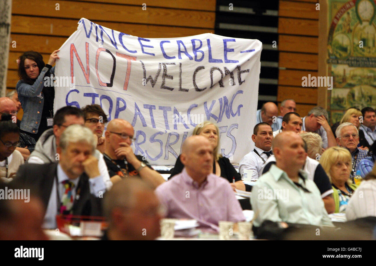 GMB members show their disapproval as Business Secretary Vince Cable speaks at the GMB conference at the Brighton Centre in Sussex. Stock Photo