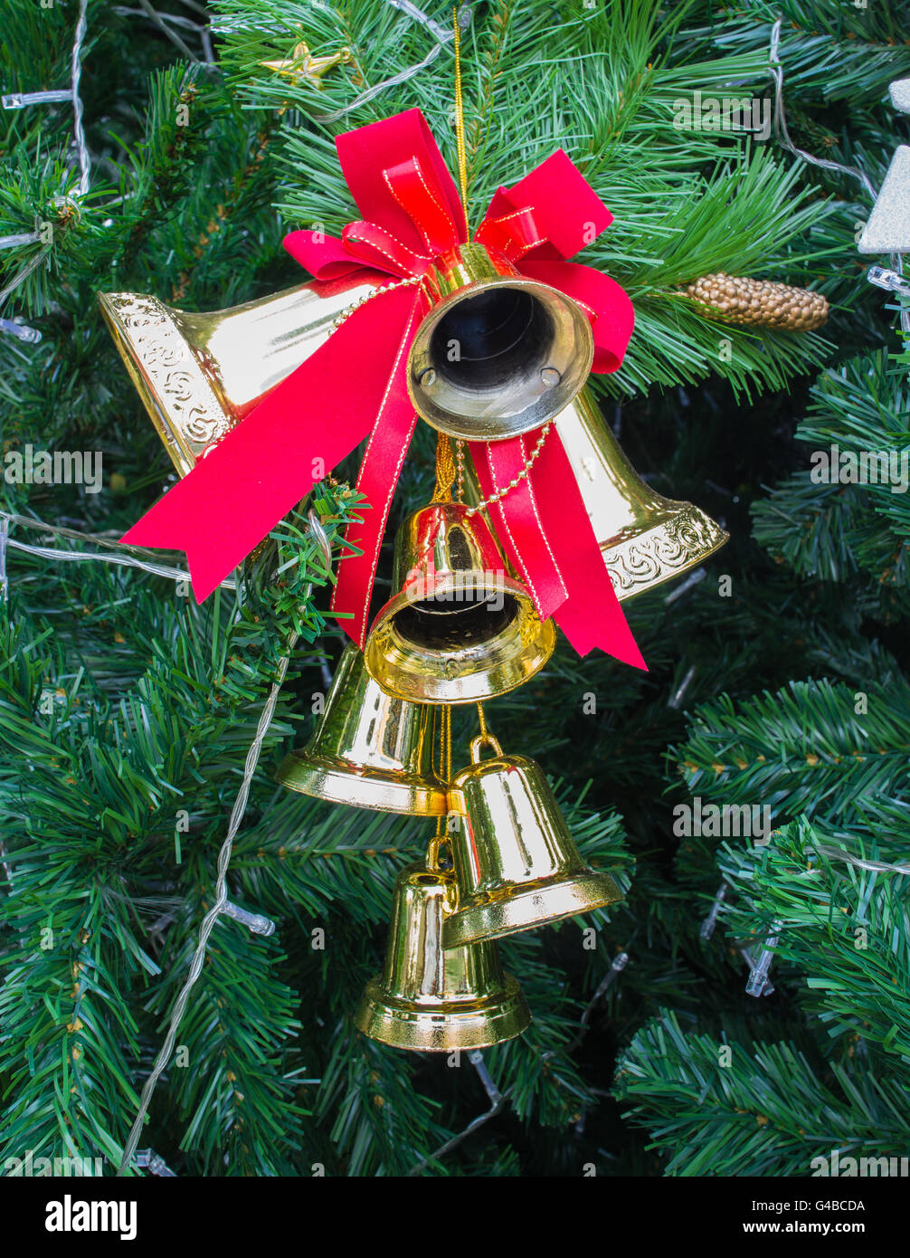 christmas bells and pine twigs Stock Photo