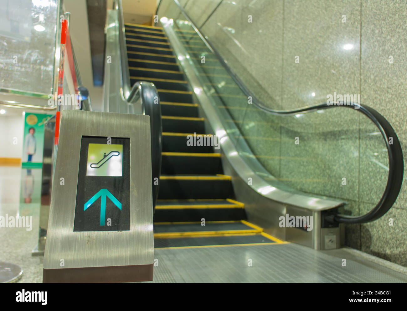 warning sign on escalator Stock Photo