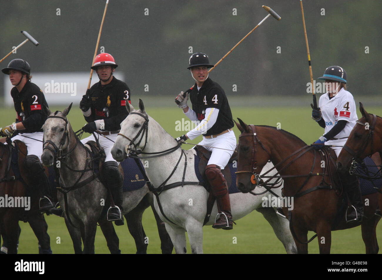 The Duke of Cambridge (Black 4) takes part in a charity polo tournament against a team including his brother Prince Harry, in aid of disadvantaged African children, at Cowarth Park, Sunninghill, near Ascot. Stock Photo