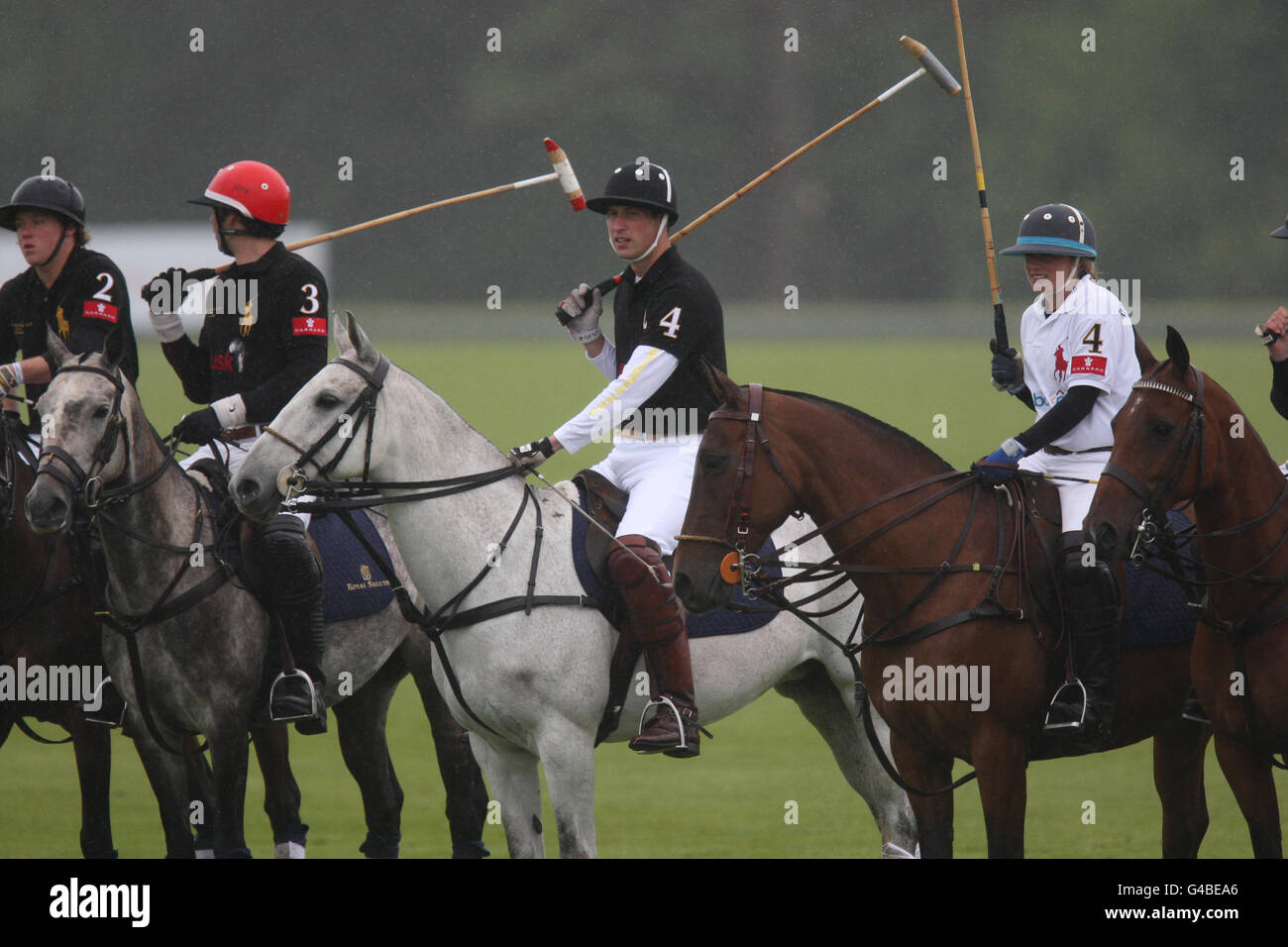 The Duke of Cambridge (Black 4) takes part in a charity polo tournament against a team including his brother Prince Harry, in aid of disadvantaged African children, at Cowarth Park, Sunninghill, near Ascot. Stock Photo