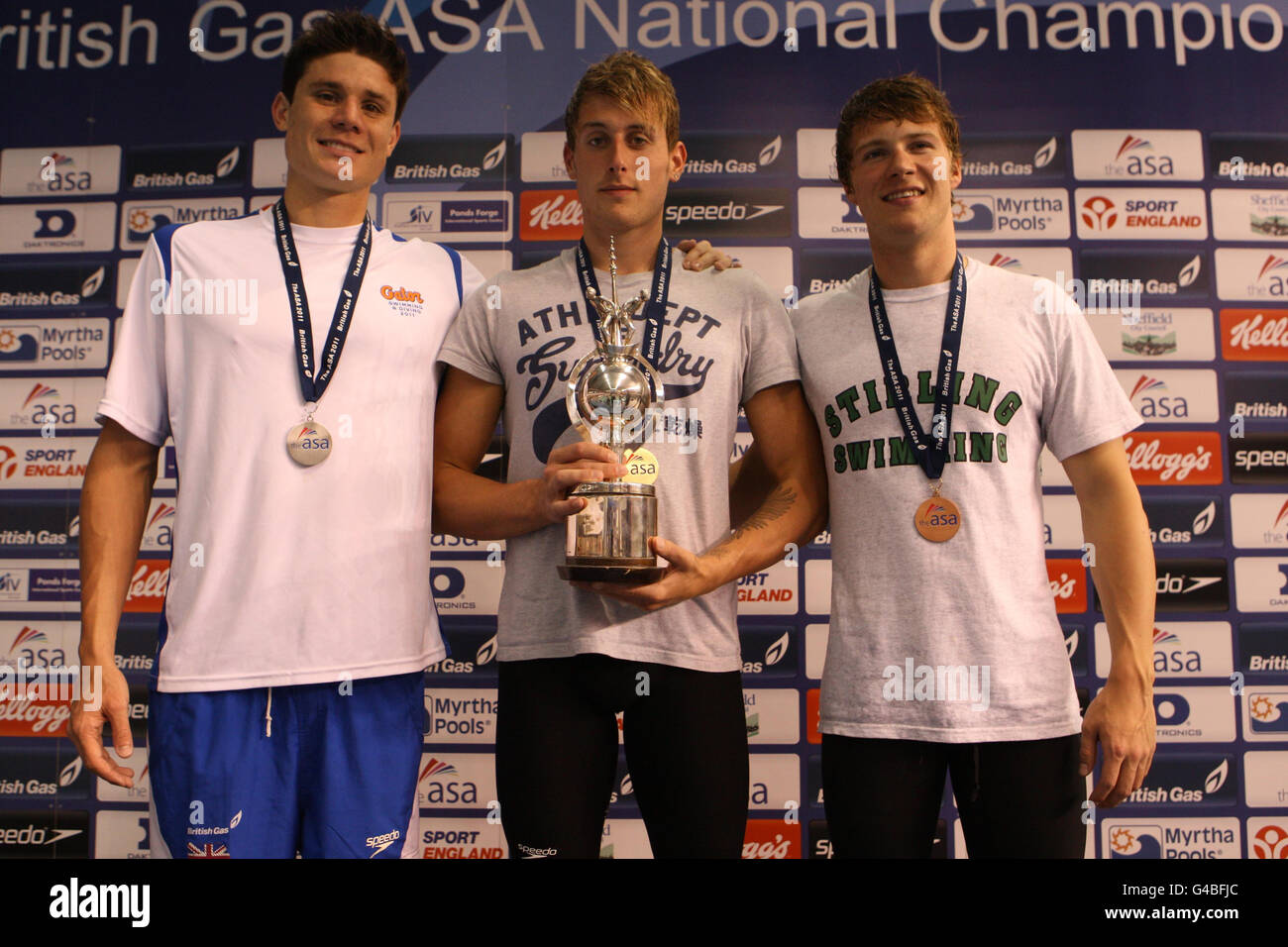 Chris Walker-Hebborn (Gold) winner of the Men's Open 100m Backstroke with Marco Loughran (Silver) and Ryan Bennett (Bronze) during the ASA National Championships at Ponds Forge, Sheffield. Stock Photo