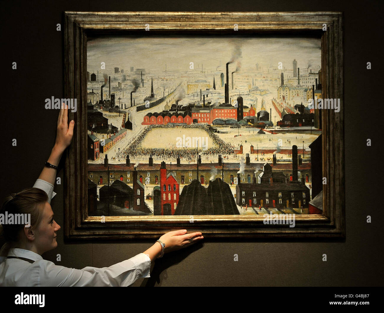 The Football Match by L S Lowry (Lawrence Stephen, 1887-1976) is hung on display at Christies Auctioneers in St James's central London, where it is expected to be sold for between 3.5 - 4.5million. Stock Photo