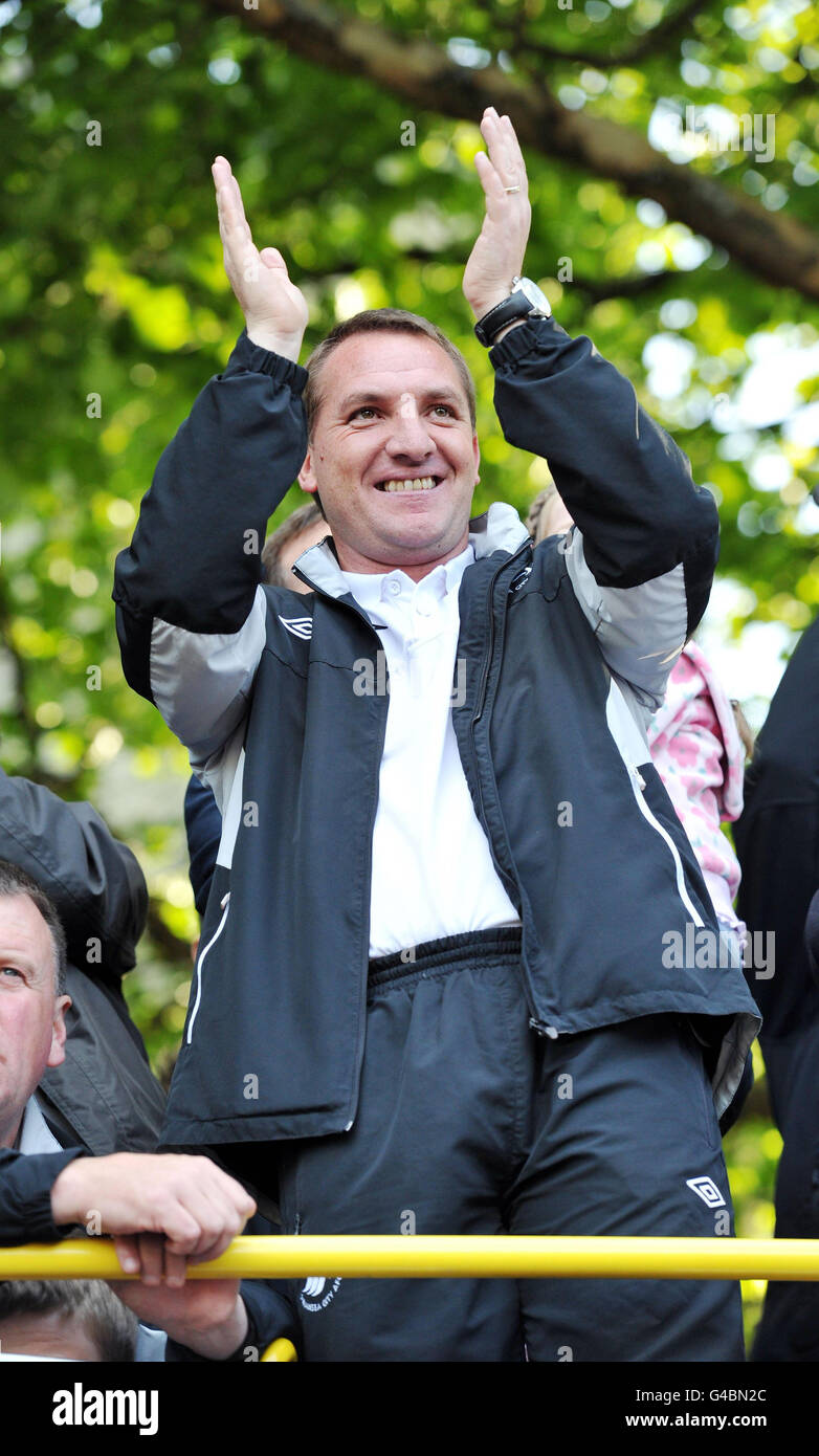 Swansea City manager Brendan Rodgers on top of the bus after it arrived at Swansea Guildhall during the bus parade through Swansea. Stock Photo