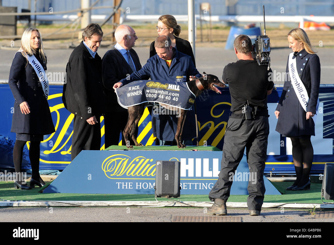 Greyhounds - Wimbledon Greyhound Stadium. Adageo with his owners after ...