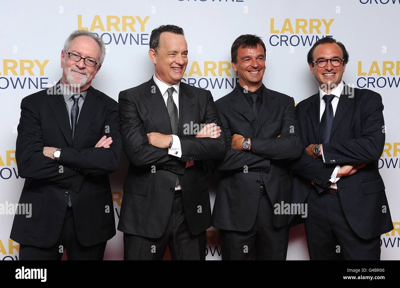 (l-r) Producer Gary Goetzman, Tom Hansk, producer Philippe Rousselet and producer Fabrice Gianfermi arriving for the World Premiere of Larry Crowne, at the Westfield Shopping Centre, White City, London. Stock Photo