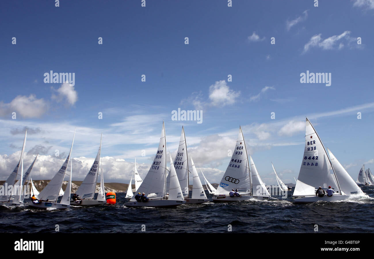 The Star fleet round the weather mark during day four of the Skandia Sail for Gold Regatta in Dorset. Stock Photo