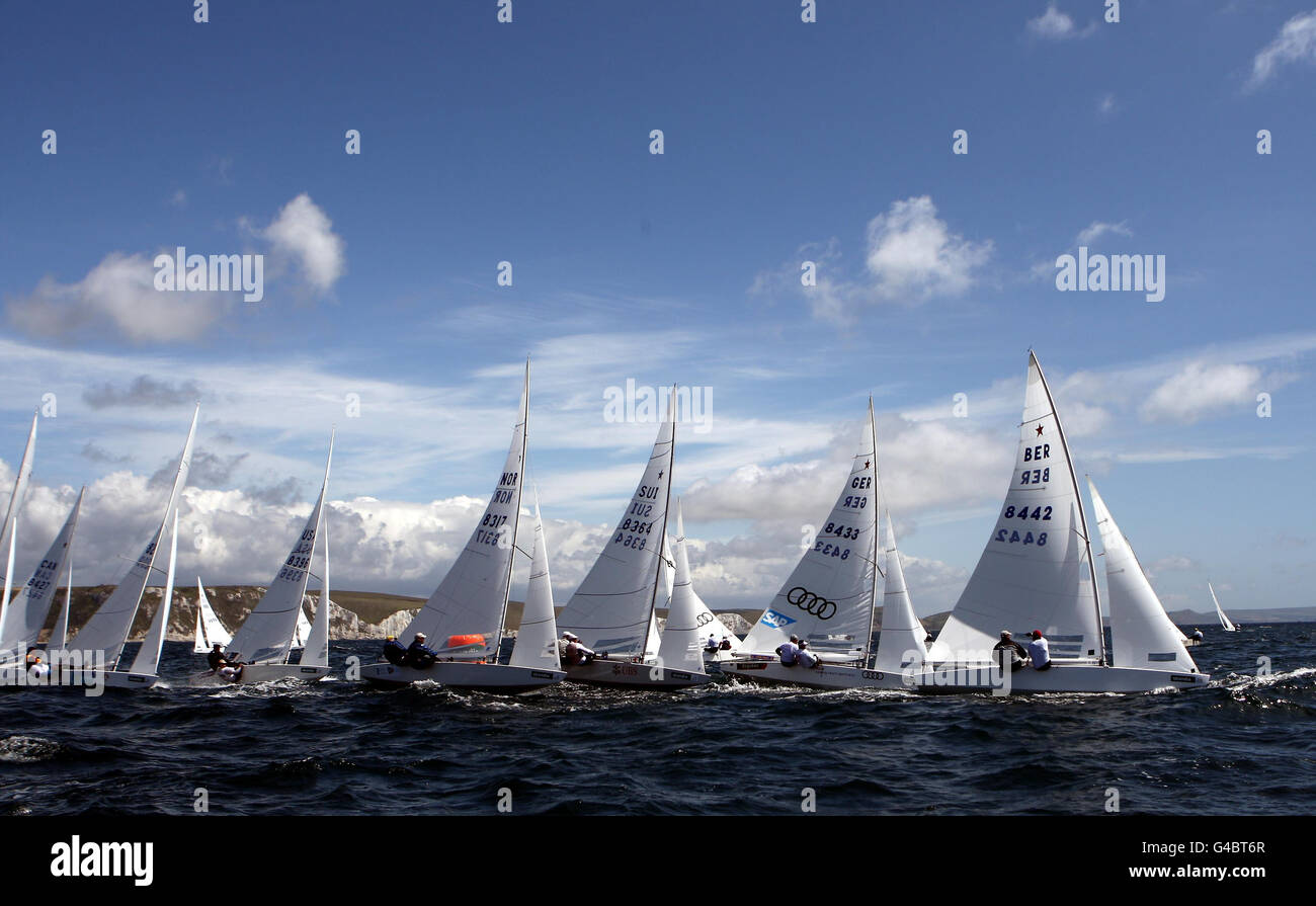 The Star class round the weather mark during day four of the Skandia Sail for Gold Regatta in Dorset. Stock Photo