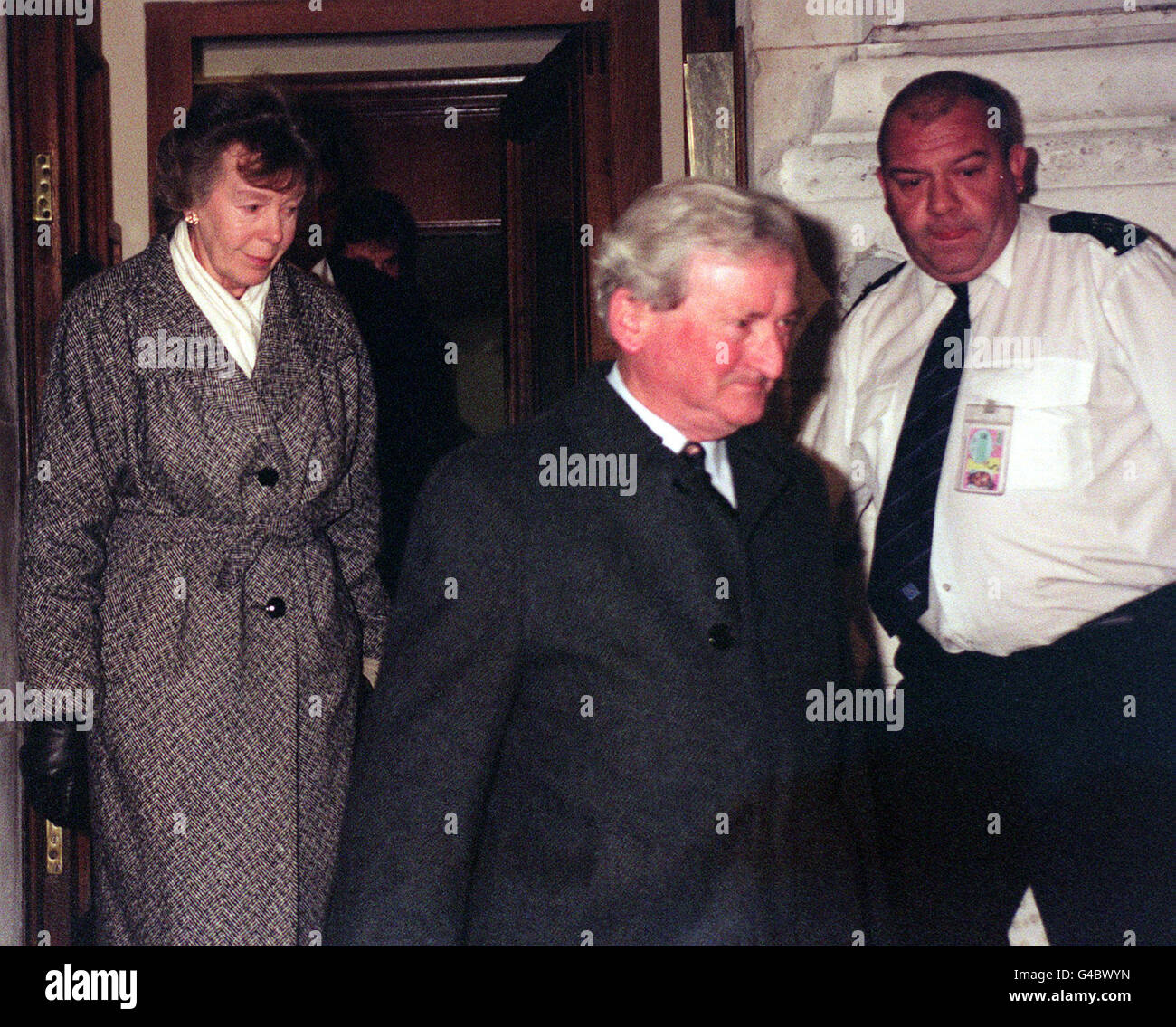 Library file, dated 21/11/96. Roy and Betty Howes leave the Foreign Office in London: A team of Scotland Yard detectives investigating the fate of their son, missing British mine clearance expert Christopher Howes, today (Sun) reported that he was murdered shortly after his kidnap by Khmer Rouge guerrillas, in Cambodia, two years ago. See PA story HOSTAGE Cambodia. Photo by Tony Harris/PA. Stock Photo