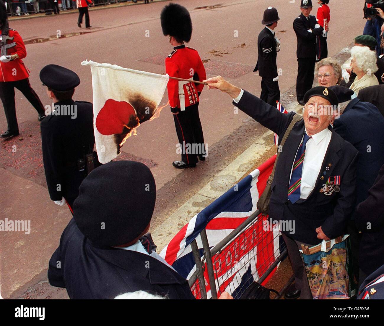 Jack Caplan From Glasgow Of The Royal Corps Of Singnals Holds A Burning Japanese Flag In London S Mall Today Tuesday In Protest To Emperor Akihito State Visit To Britain Photo By Ben
