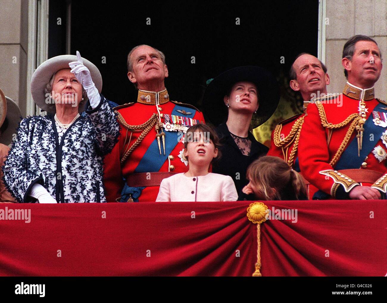 The Queen and the Duke of Edinburgh watch the traditional fly-past from the balcony of Buckingham Palace following the Trooping of the Colour in honour of the Queen's official birthday today (Saturday). Left to right: The Queen, The Duke of Edinburgh, Princess Eugenie (pink dress), Lady Helen Taylor (dressed in black), unidentified young girl, The Duke of Kent and Prince Charles. See PA story ROYAL Trooping. WPA rota picture by John Stillwell/PA Stock Photo