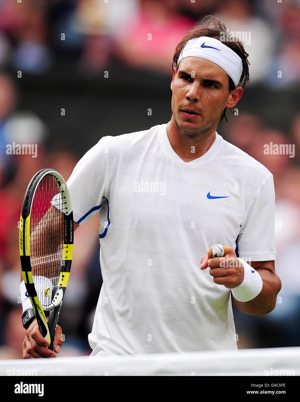 Spain's Rafael Nadal celebrates against USA's Michael Russell during the 2011 Wimbledon Championships at the all England Lawn Tennis and Croquet Club, Wimbledon. Stock Photo