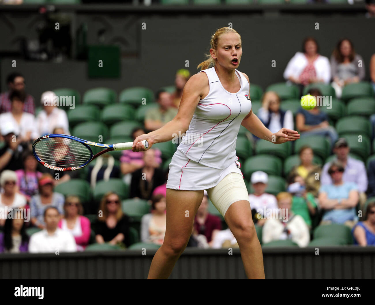 Australia's Jelena Dokic in action against Italy's Francesca Schiavone during day one of the 2011 Wimbledon Championships at the all England Lawn Tennis and Croquet Club, Wimbledon. Stock Photo