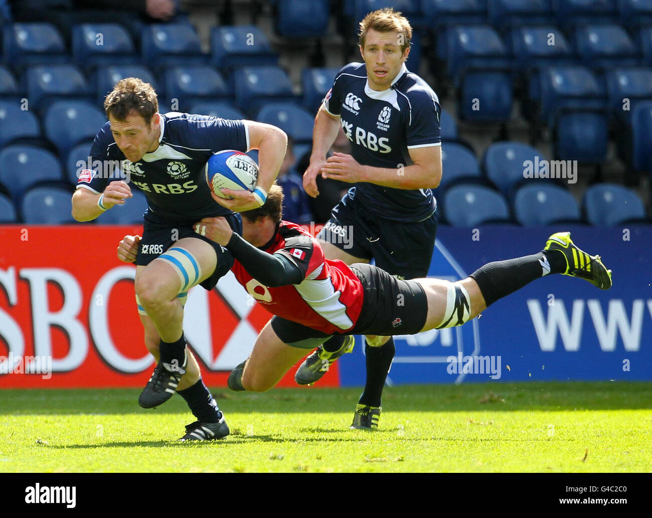 Scott Riddel Scotland's Scott Riddell is challenged by Canada's Mike Scholz during ...