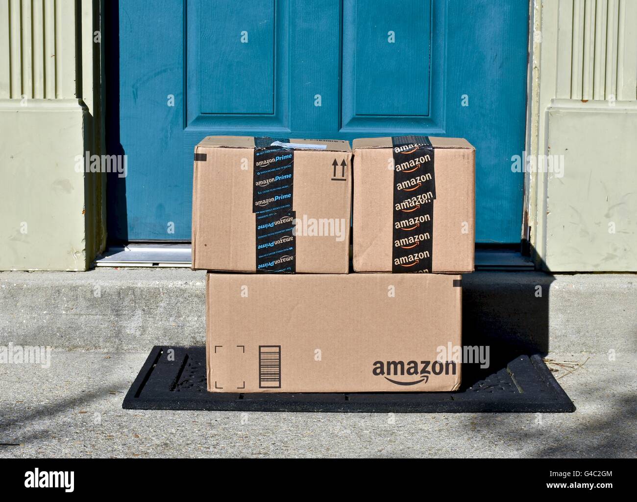 Amazon Prime boxes delivered to the front door of a home Stock Photo