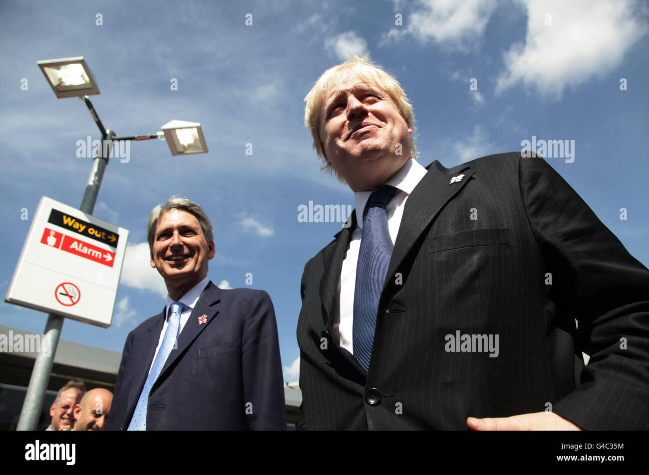 Mayor of London Boris Johnson (right) and Transport Secretary Philip Hammond after travelling on a train to Stratford station on the new DLR extension, which is due to open to the public later this summer, and will provide a new link into Stratford as well as a key link between Stratford and other Olympic venues at the ExCel Exhibition Centre and Woolwich Arsenal. London. Stock Photo