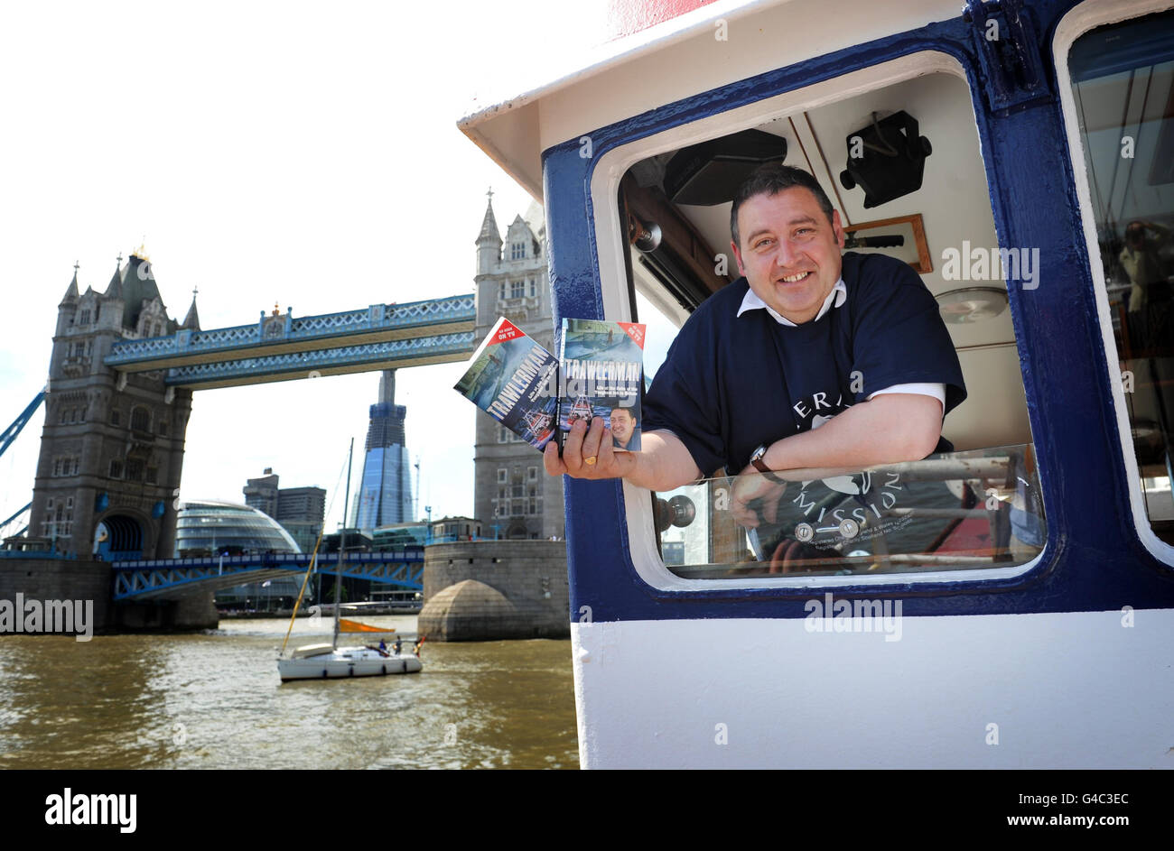 Jimmy Buchan, star of the TV series Trawlerman, on board his North Sea Trawler, Amity II, by Tower Bridge on the River Thames in London, as he marks the publication of 'Trawlerman' - his memoirs of being at the helm of Britain's most dangerous job for over 30 years. Stock Photo