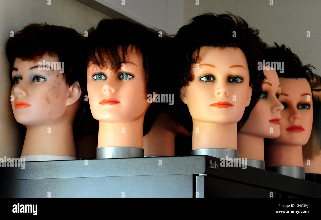 General view of hairdressers model heads on which detainees learn hairdressing and barber skills at Morton Hall Immigration Removal Centre, near, Swinderby, Lincolnshire. Stock Photo