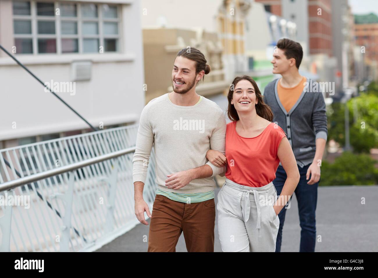 MODEL RELEASED. Three young friends walking. Stock Photo