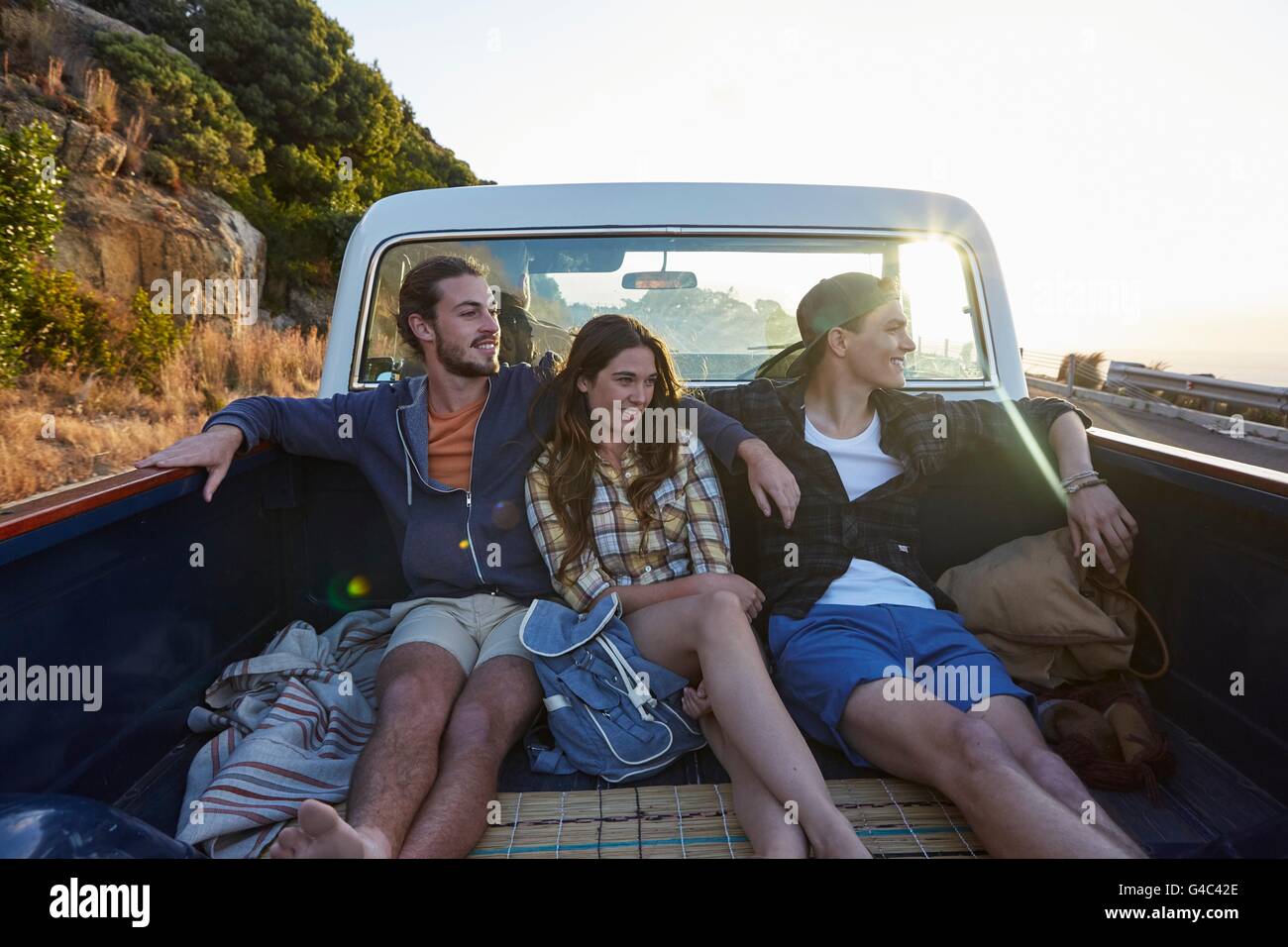 MODEL RELEASED. Young friends in pick up truck. Stock Photo