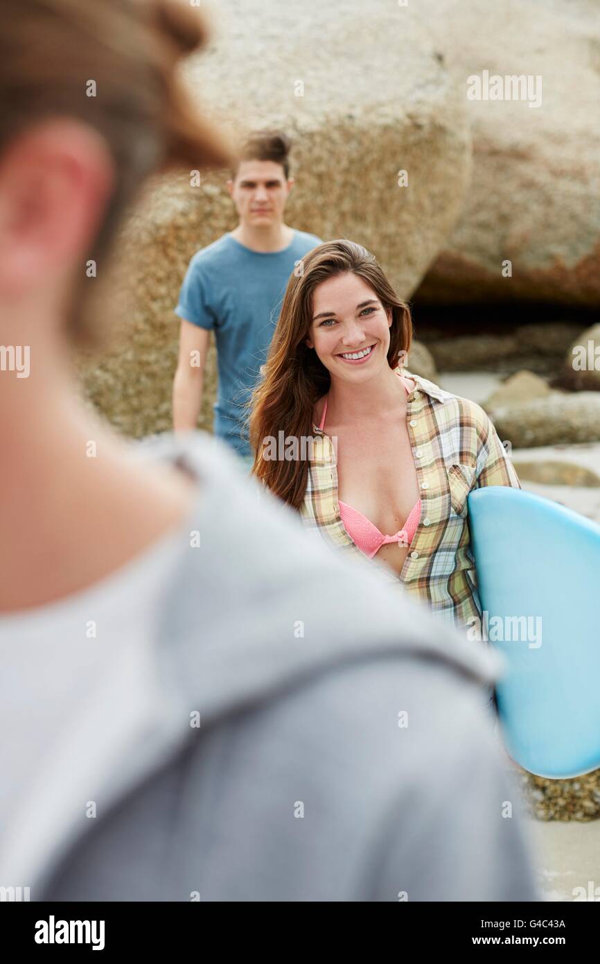 MODEL RELEASED. Young woman with surfboard. Stock Photo