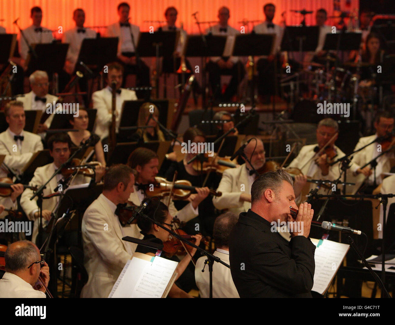 Film critic Mark Kermode plays the harmonica with the BBC Philharmonic