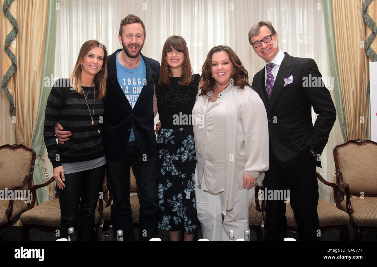 Stars of the new film Bridesmaids, from left, writer and actress Kristen Wiig, Chris O'Dowd, Rose Byrne, Melissa McCarthy and director Paul Feig, attend a pre-release news conference. Stock Photo