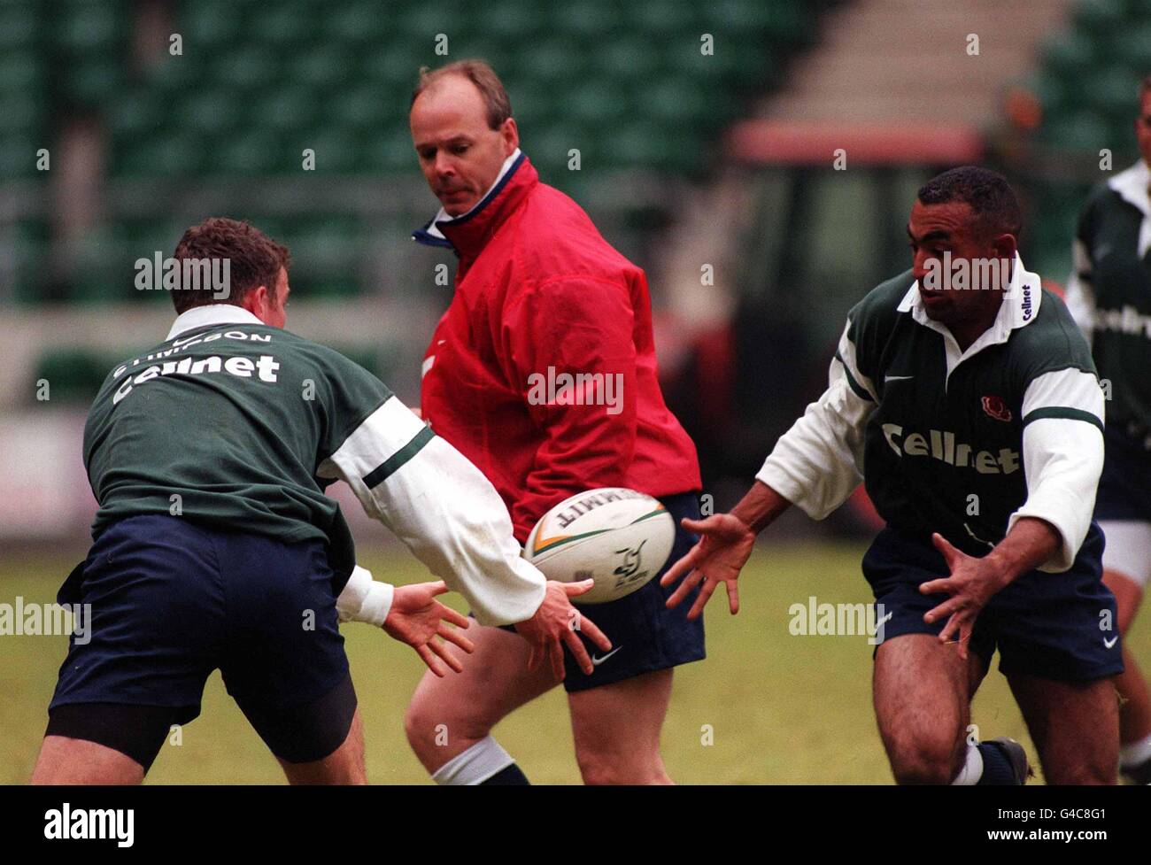 England Rugby coach Clive Woodward (Centre) flanked by his new international, Richmond wing Spencer Brown (right), and Tim Stimpson of Leicester Tigers, during training at Twickenham today (Weds), before they take on