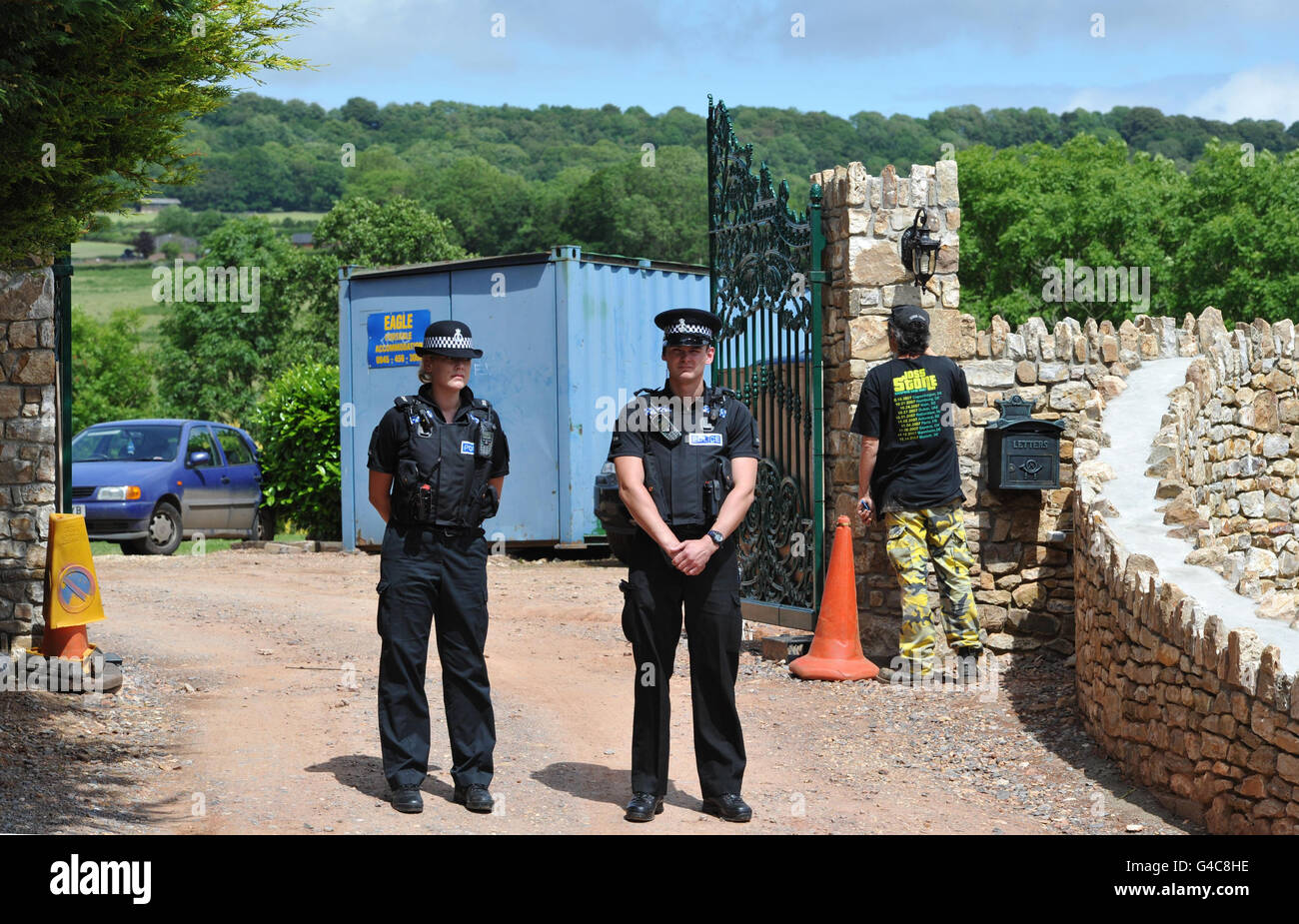 Police outside the gate to singer Joss Stone's house near Cullompton after two men were arrested yesterday on suspicion of conspiracy to rob and murder after being arrested close to the millionaire's home. Stock Photo