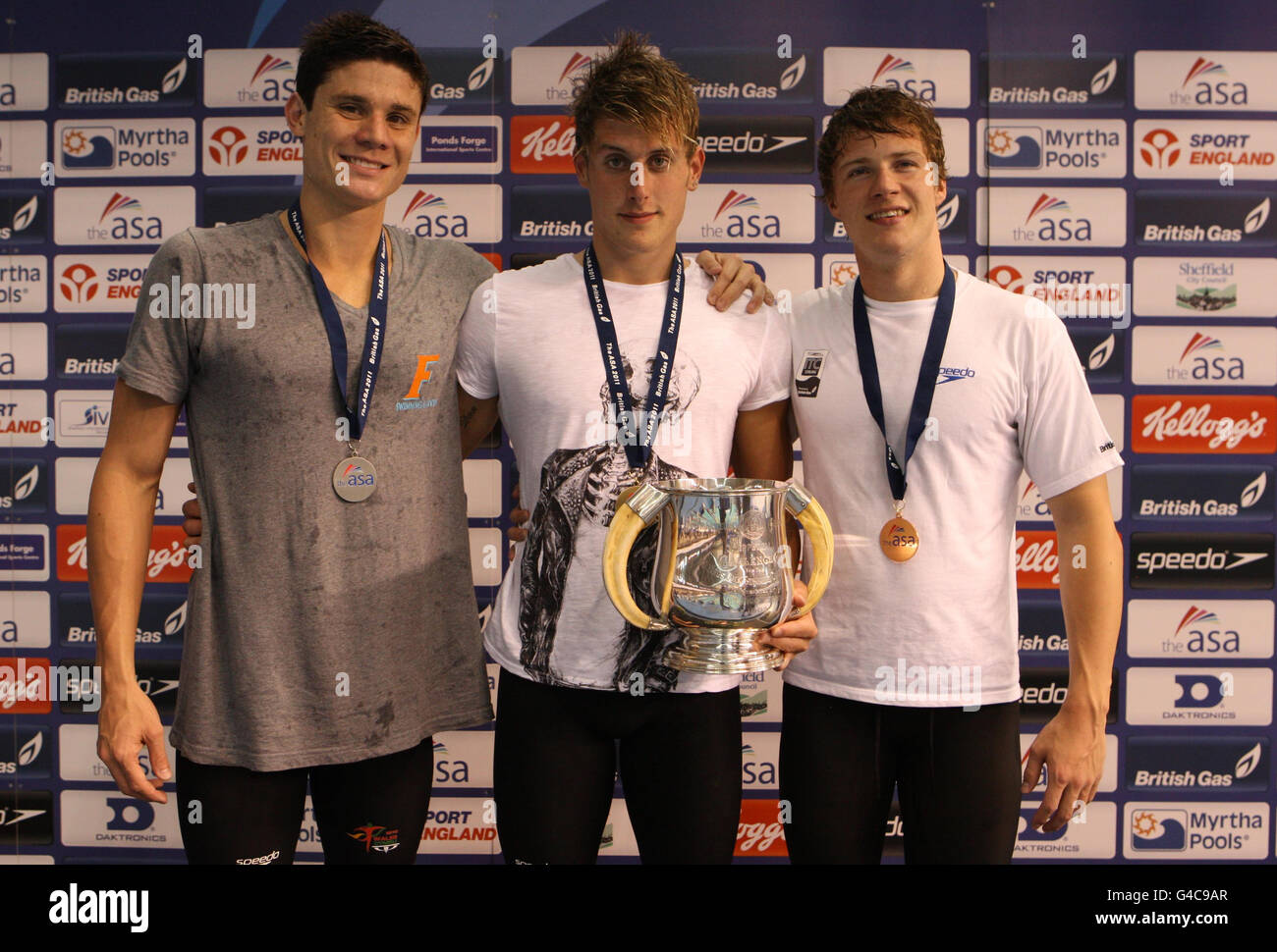 British swimmer Chris Walker-Hebborn (centre) Gold with Marco Loughran (Silver) and Ryan Bennet (Bronze) after the Final of Men's Open 200m Backstroke during the ASA National Championships at Ponds Forge, Sheffield. Stock Photo
