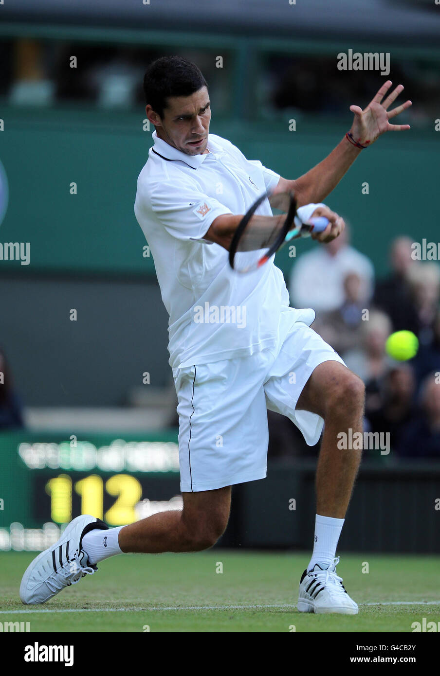 Romania's Victor Hanescu in action against USA's Andy Roddick during Day Three of the 2011 Wimbledon Championships at the All England Lawn Tennis. Stock Photo