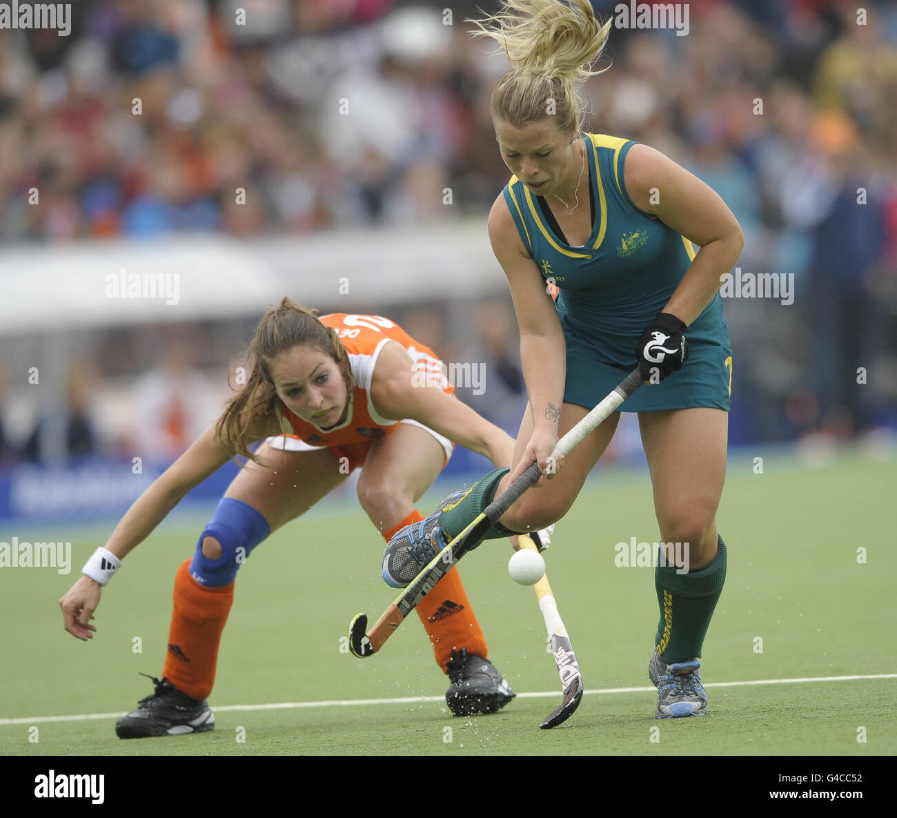 Australia's Jade Warrender gets away from Netherland's Eva de Goede during the Rabo FIH Women's Champions Trophy match at the Wagener Stadium, Amsterdam Stock Photo