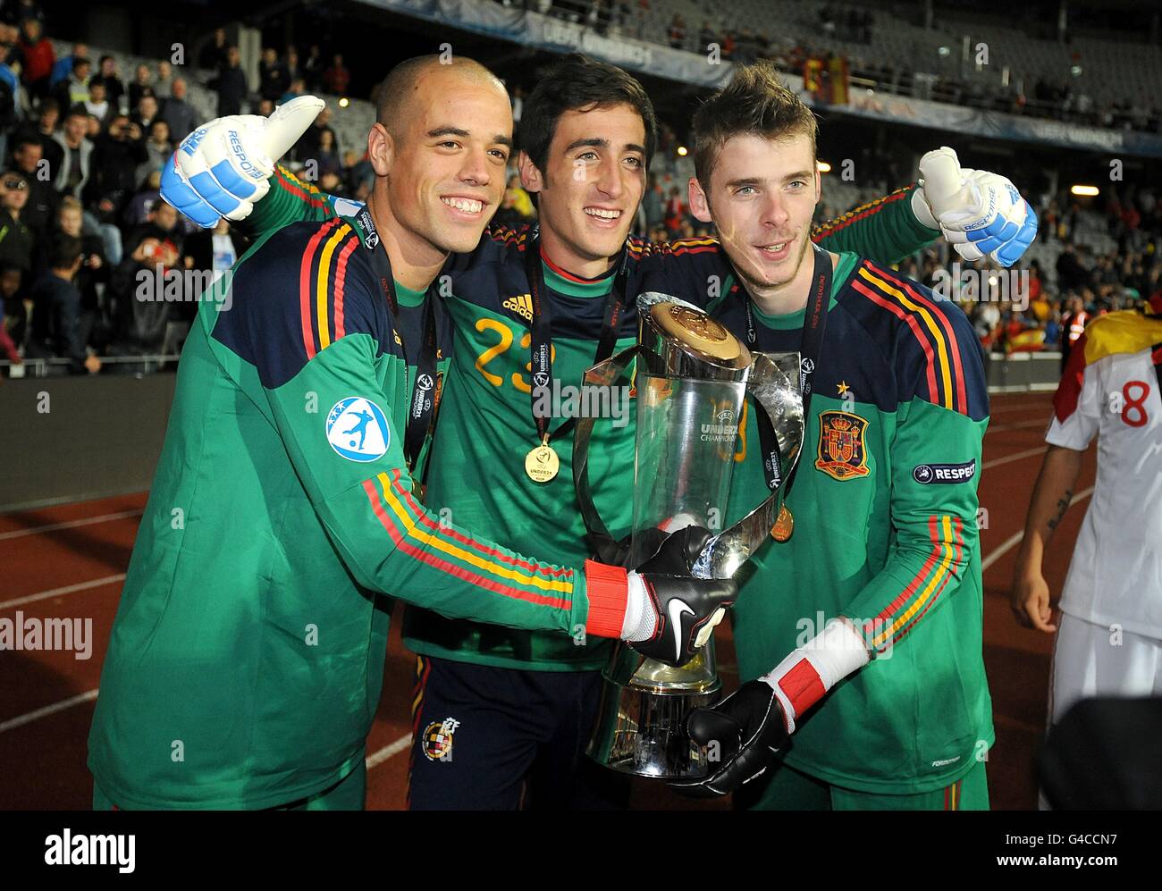 Spain goalkeepers Ruben Mino (left), Diego Marino (centre) and David de Gea celebrate with the UEFA European Under 21 Championship trophy Stock Photo