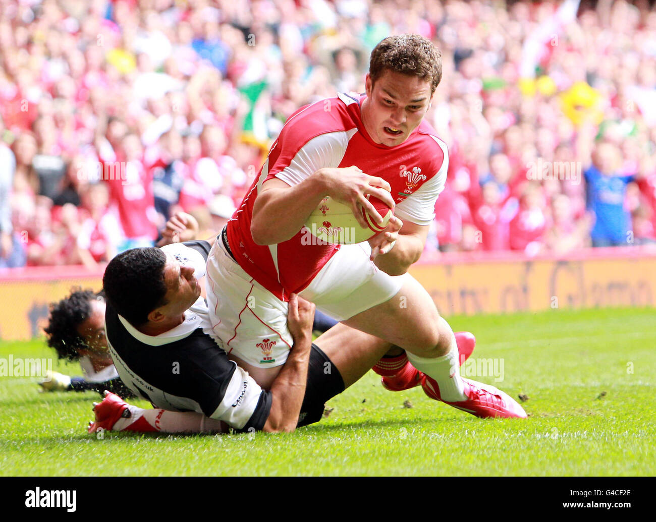 Wales' George North scores the opening try during the 130th Anniversary Celebration Game at the Millennium Stadium, Cardiff. Stock Photo