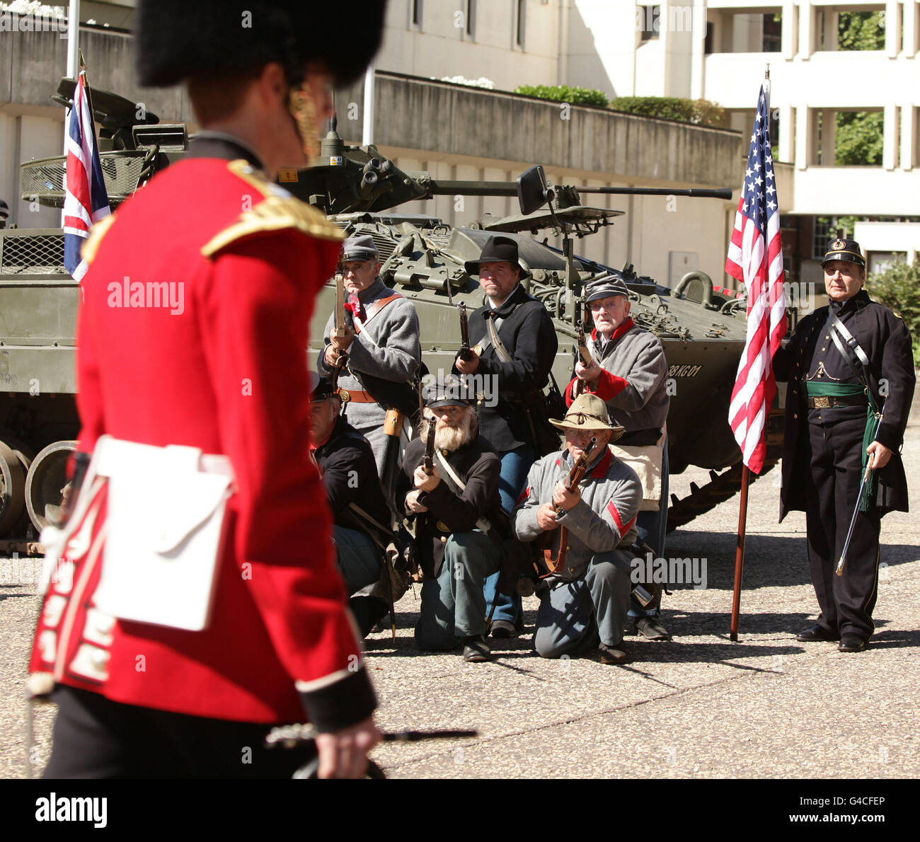Members of The Southern Skirmish Association (SoSkAn) American Civil War Re-enactment Society with a soldier from the Grenadier Guards, during the launch of The British Military Tournament at Wellington Barracks in central London. Stock Photo