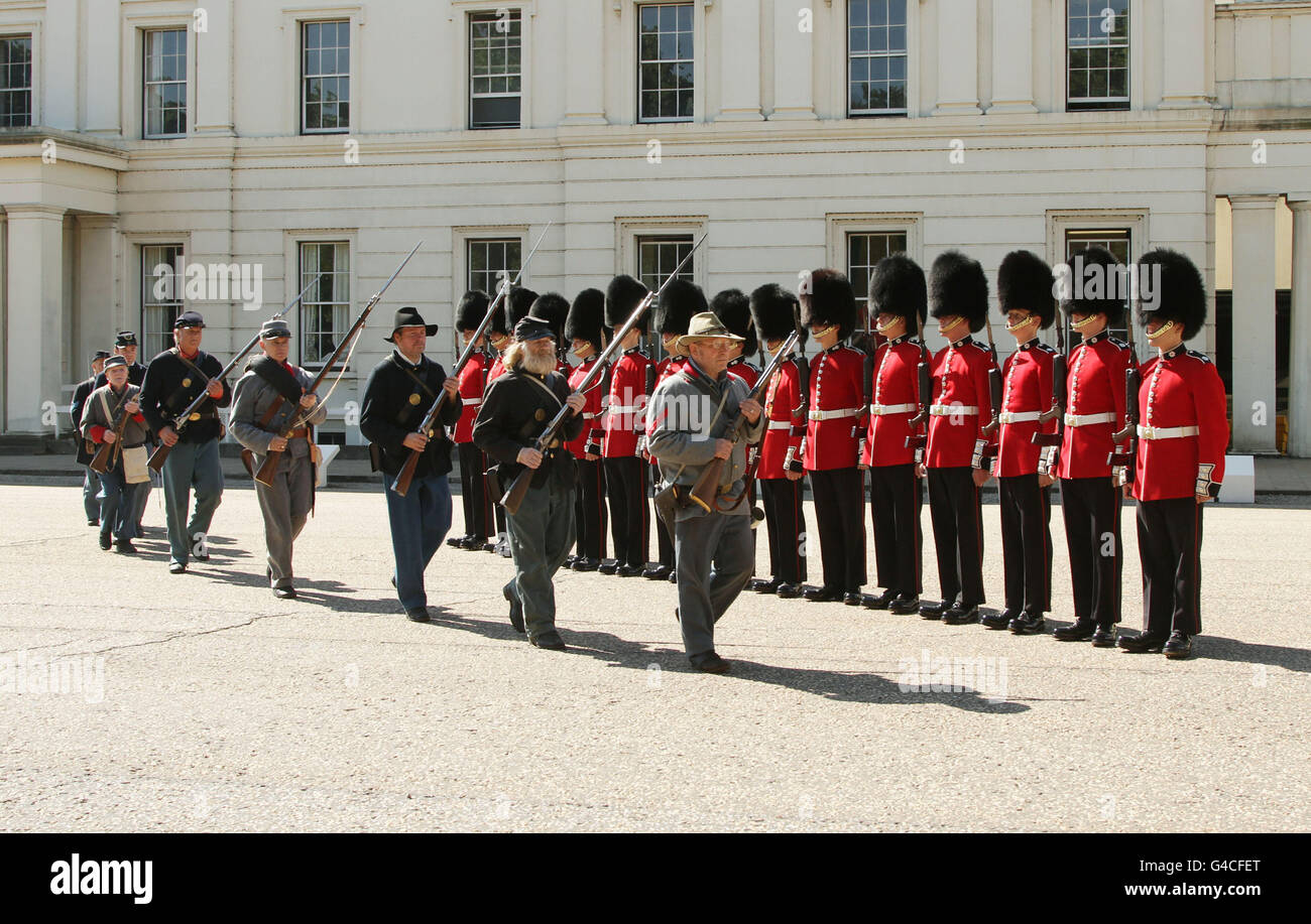 Members of The Southern Skirmish Association (SoSkAn) American Civil War Re-enactment Society with soldiers from the Grenadier Guards, during the launch of The British Military Tournament at Wellington Barracks in central London. Stock Photo