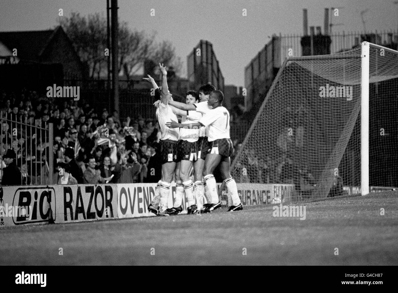 PA NEWS PHOTO : 27/4/88 : ENGLAND'S PAUL GASCOIGNE (LEFT) IS CONGRATULATED BY TEAM MATES (L/R) GARY PORTER, DAVID LOWE AND FRANZ CARR AT HIGHBURY AFTER SCORING THEIR FIRST GOAL AGAINST FRANCE IN THE SECOND LEG SEMI-FINAL OF THE EUROPEAN UNDER-21 CHAMPIONSHIP. Stock Photo