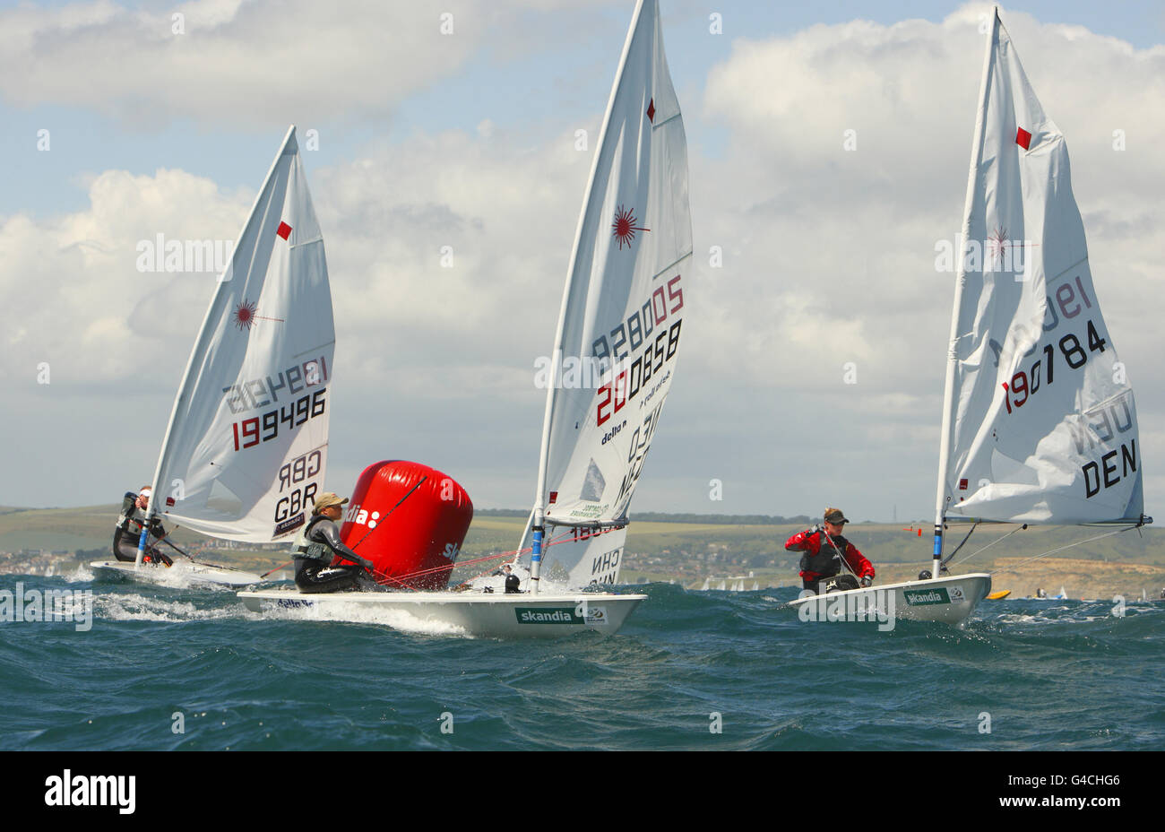 General action of racing in the Laser Radial class during day three of the  Skandia Sail for Gold Regatta in Dorset Stock Photo - Alamy